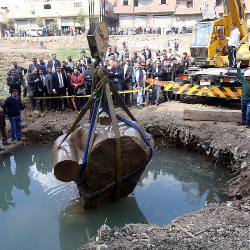 Archaeologists lift a 3,000-year-old Egyptian Pharaoh statue considered “one of the most important discoveries ever” from a muddy ditch in Cairo