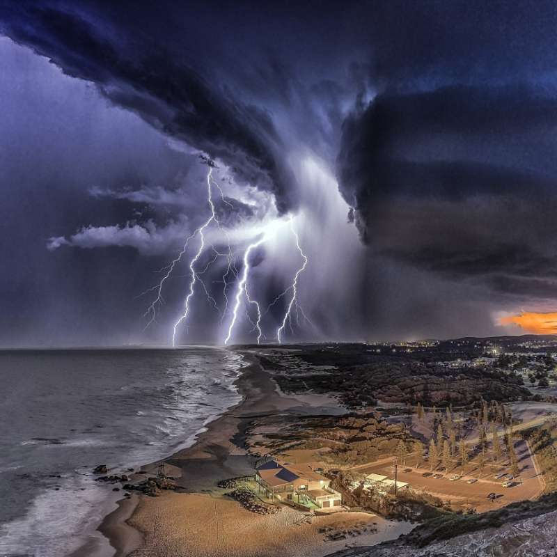 Breathtaking photos show lightning strikes illuminate Australia’s coastline as the sun sets during wild and stormy weather, As the fading sun cast its warm glow, Vin Moult skillfully framed the shots